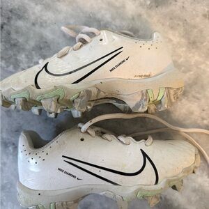 Nike White Baseball Cleats with Black Swoosh and Light Green Accents